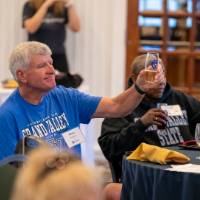 An alumni raising a toast.